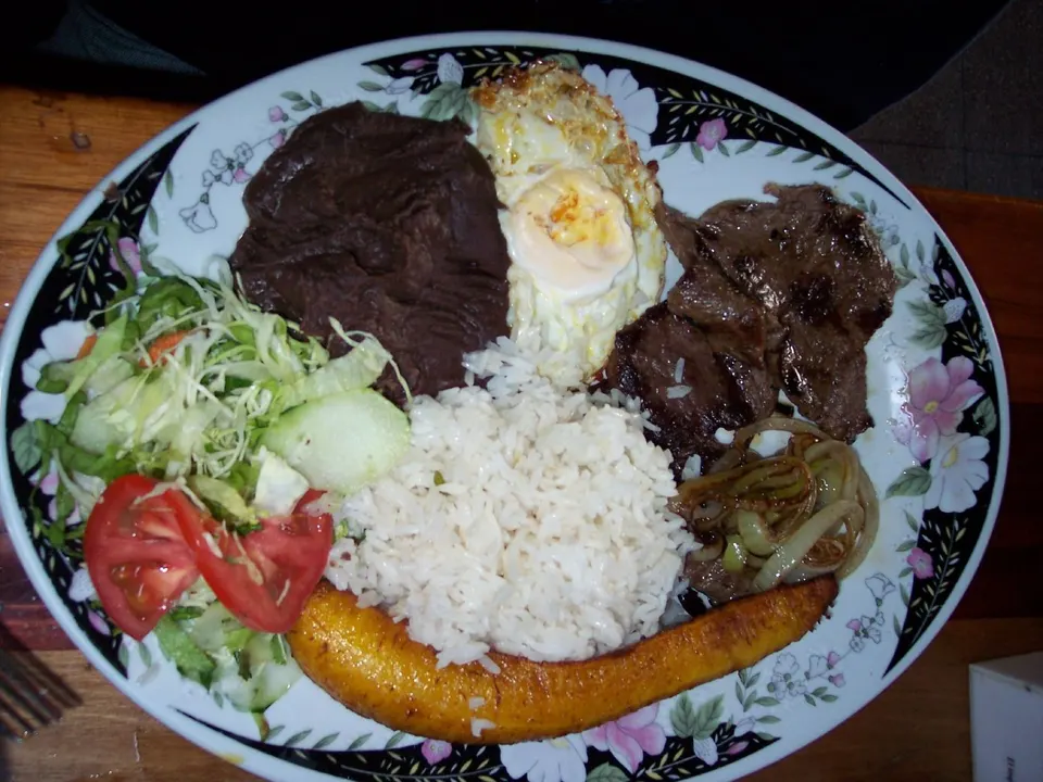 A Costa Rican lunch, called casado. Comes with rice, fried plantain, onioned meat (chicken or beef), an egg, beans and a en la-fortuna