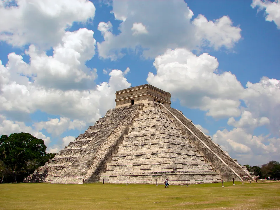 The Castle (El Castillo) at the World Heritage Site Chichen Itza. From the east side you can see both the restored side  en mexico