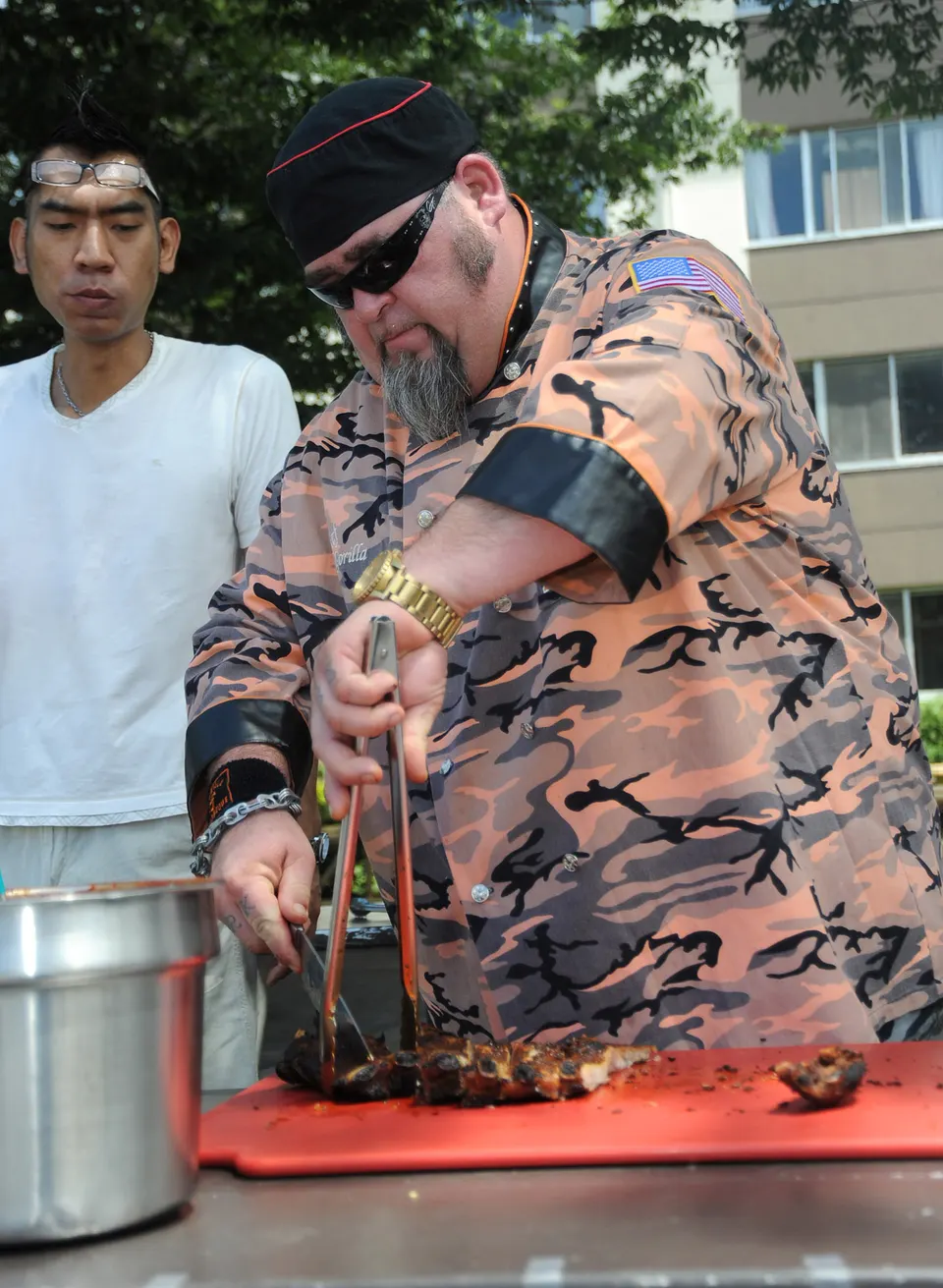 ATSUGI, Japan (Aug. 5, 2011) - American chef Rich “Gorilla” Bacchi prepares his famous ribs during a barbecue held at th en estados-unidos