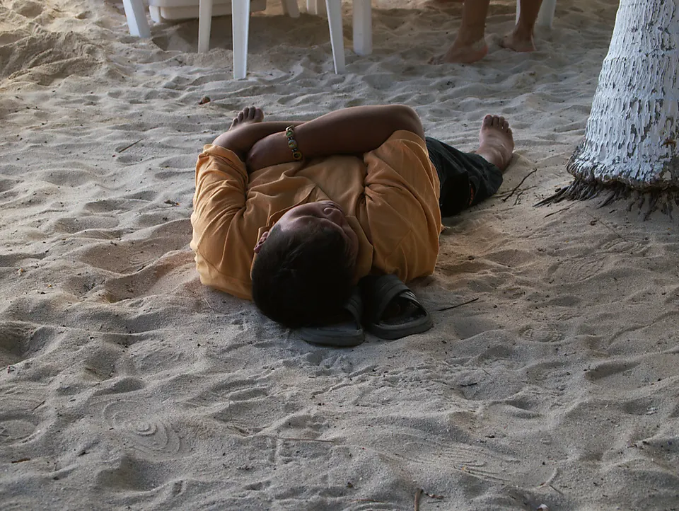 A local is taking a nap after dinner in Playa Lancheros. en cancun
